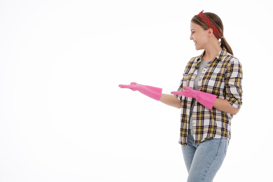Professional carpet cleaner smiling while working